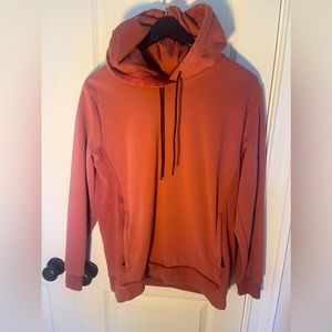 Mens Fabletics rust colored hoodie.  Size L